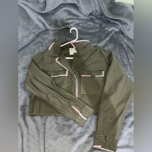 Olive green jacket with pink and mint detailing.
